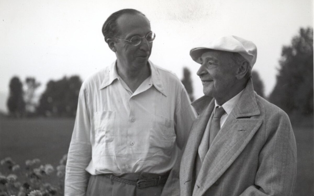 Aaron Copland and Serge Koussevitzky stand together outdoors