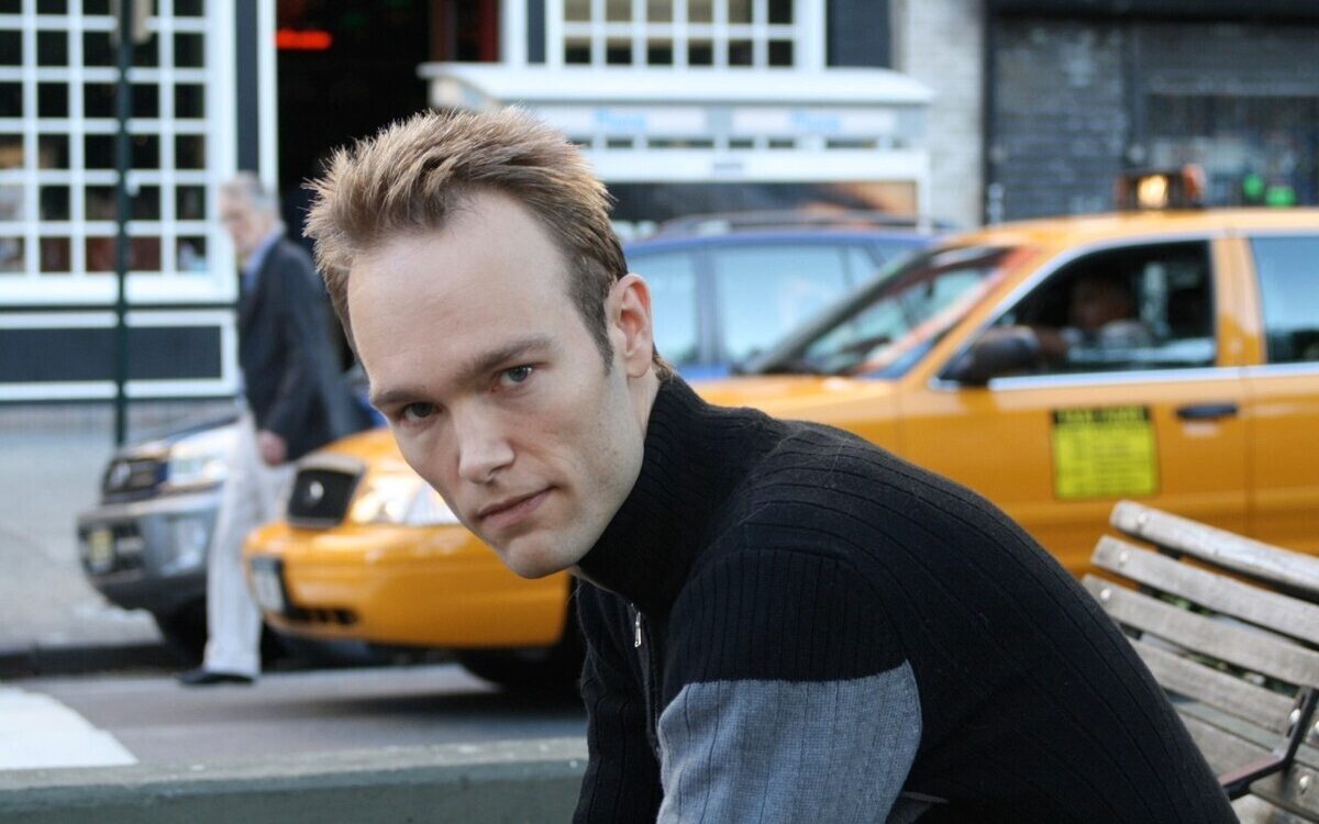 Photo of Paul Haas with a yellow taxi in the background