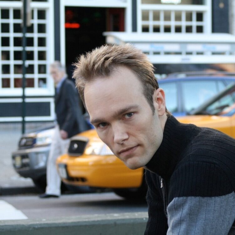 Photo of Paul Haas with a yellow taxi in the background