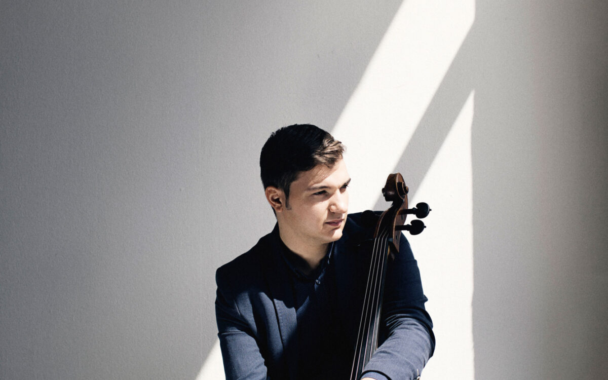 Andrei Ioniță sitting with a cello