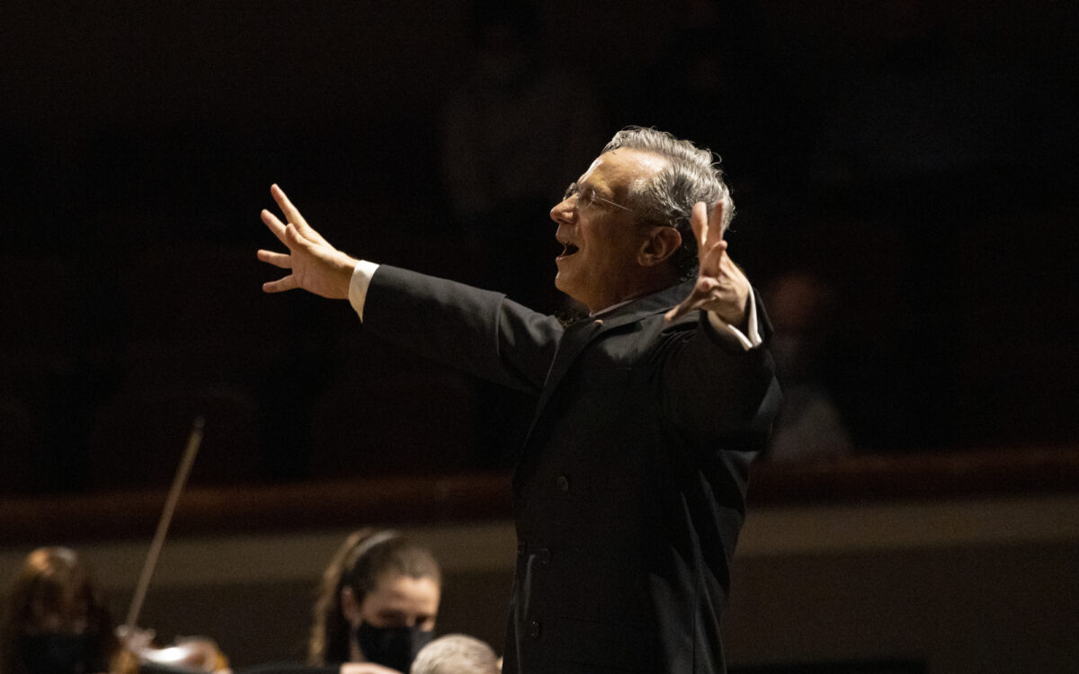 Fabio Luisi conducting with both of his arms outstretched