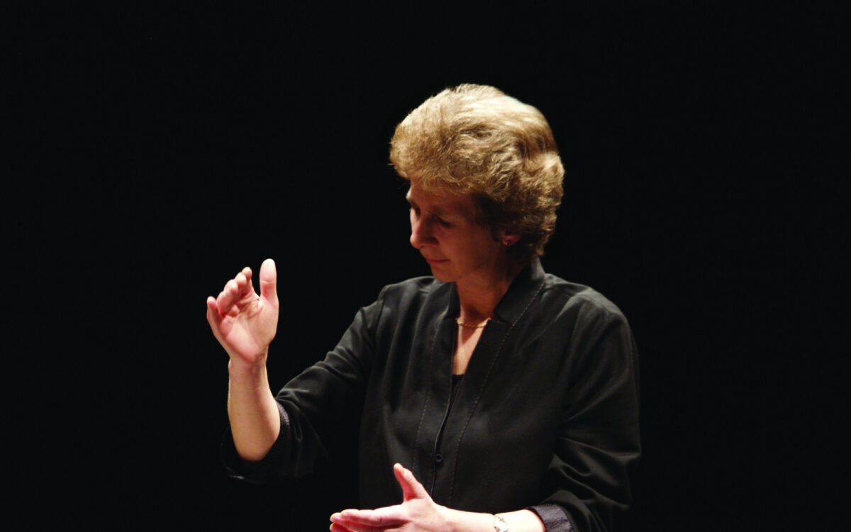 Jane Glover conducting on a stage