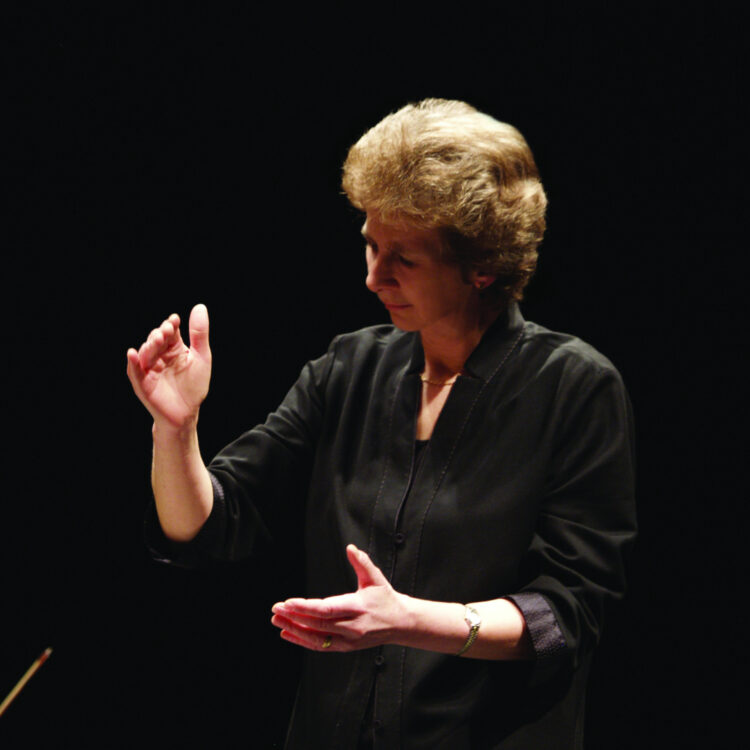 Jane Glover conducting on a stage