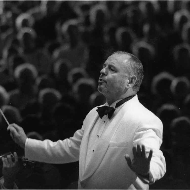John Oliver conducting with baton at Tanglwood