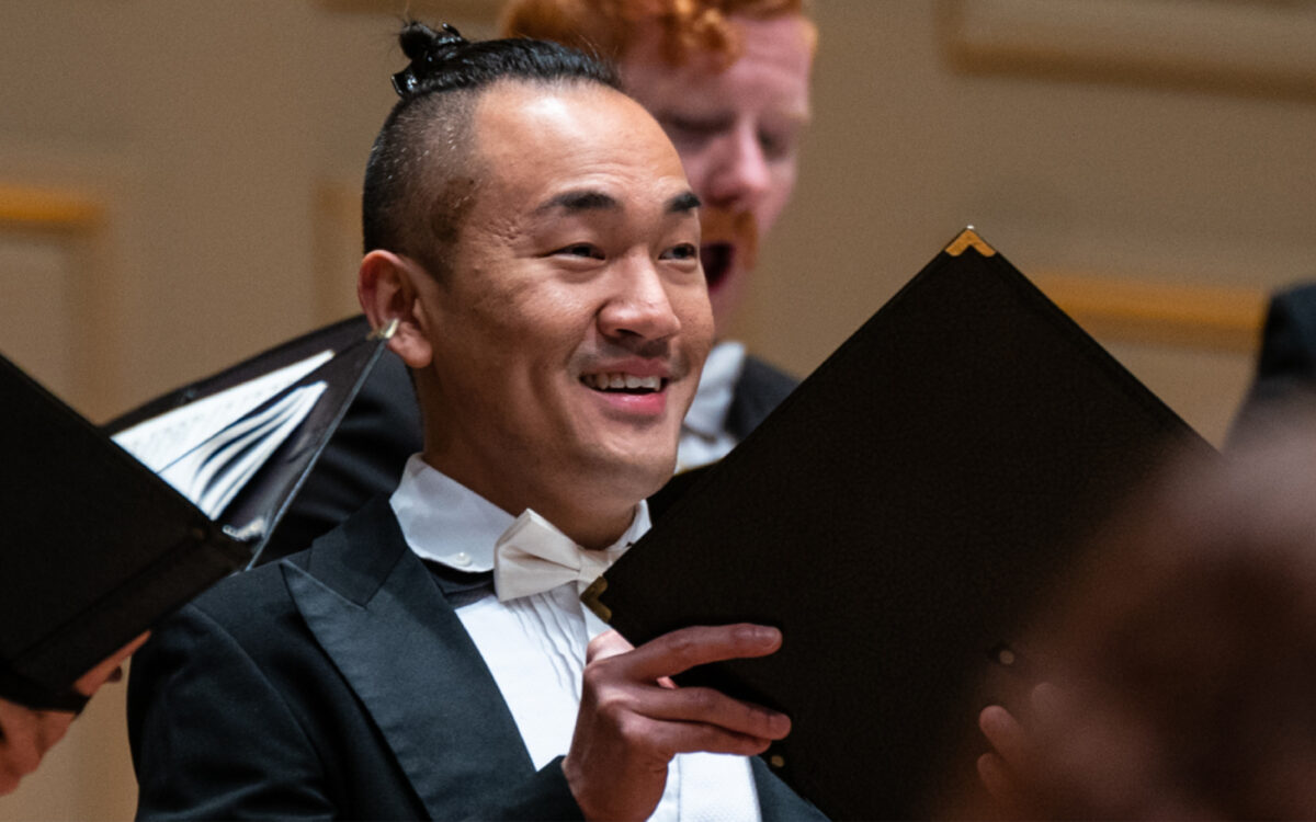 men of the Handel and Haydn society singing on stage at Symphony Hall