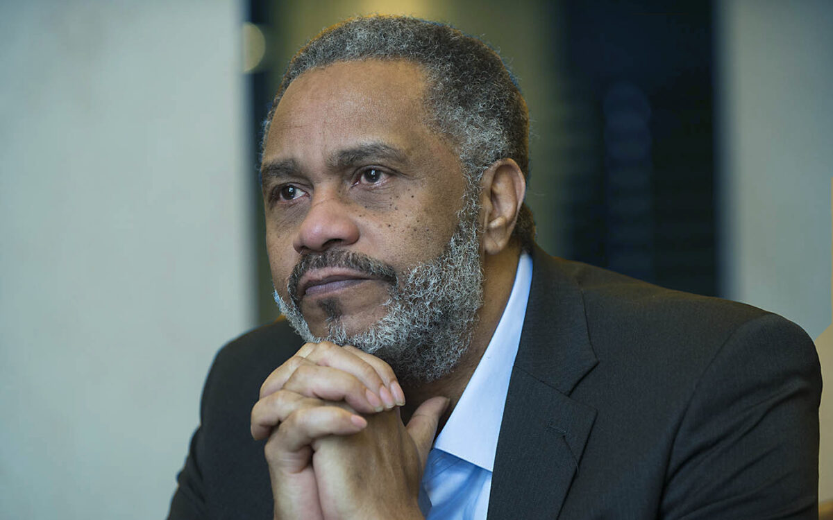 Anthony Ray Hinton sitting with his hands clasped under his chin