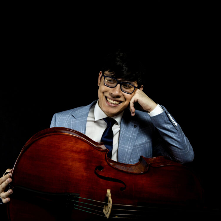 Zlatomir Fung smiling with cello on his lap