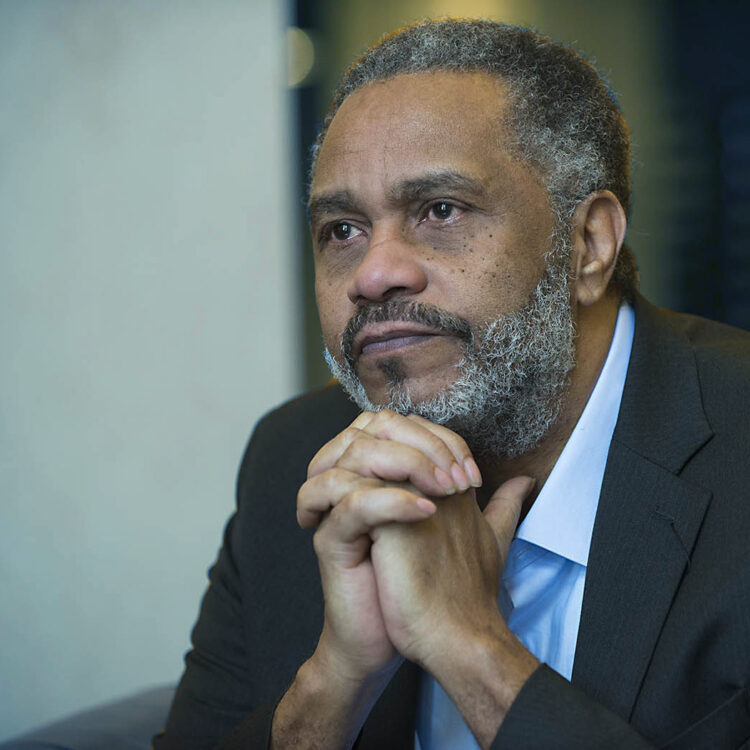 Anthony Ray Hinton sitting with his hands clasped under his chin