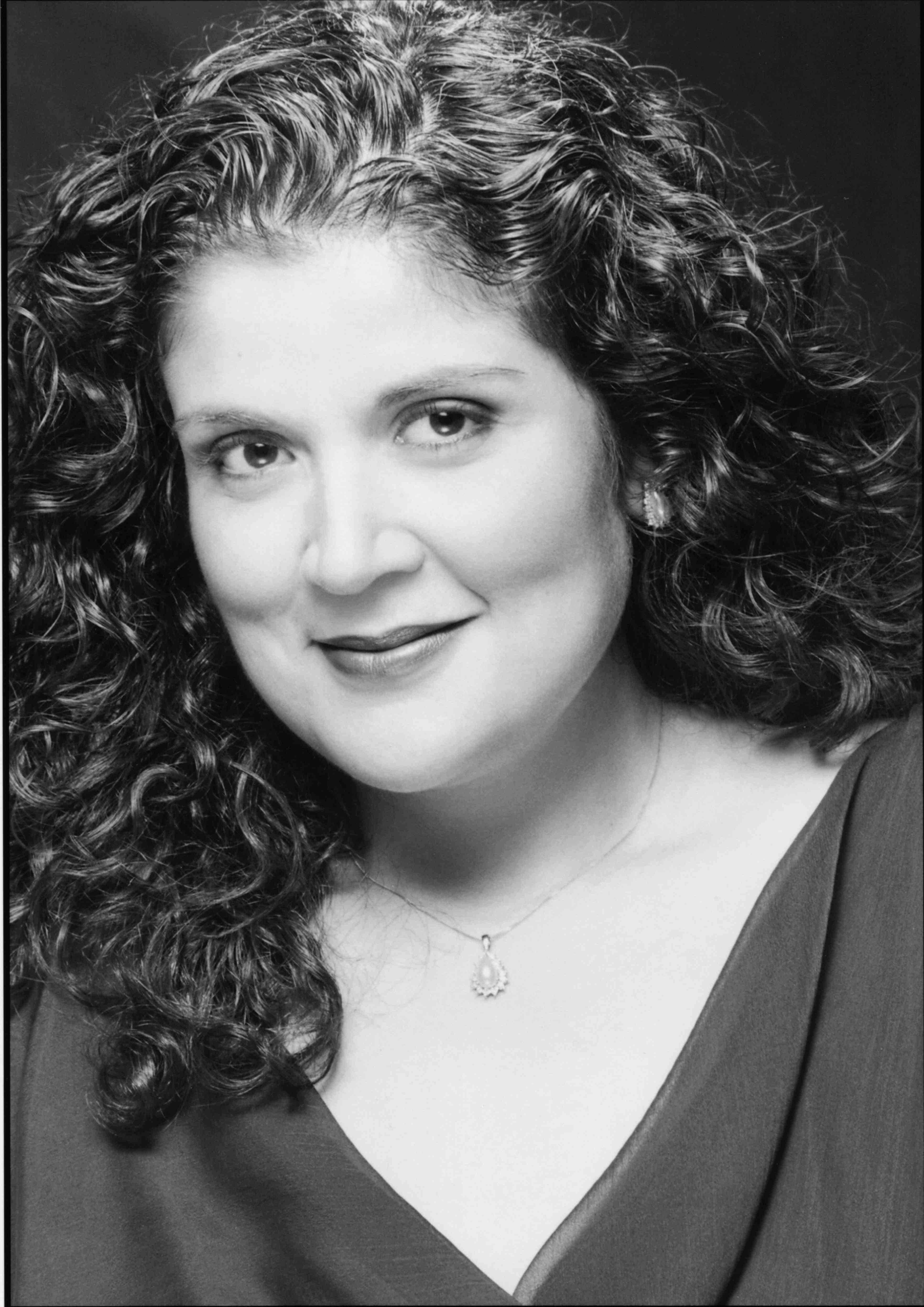 Headshot of singer Caprice Corona