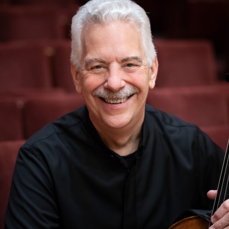 Headshot of Norman Fischer with his cello.