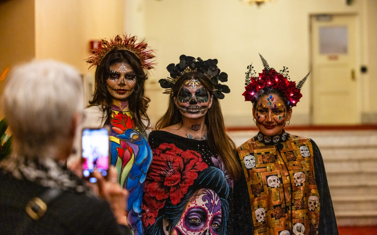 People dressed up for the 2024 Día de Muertos concert.