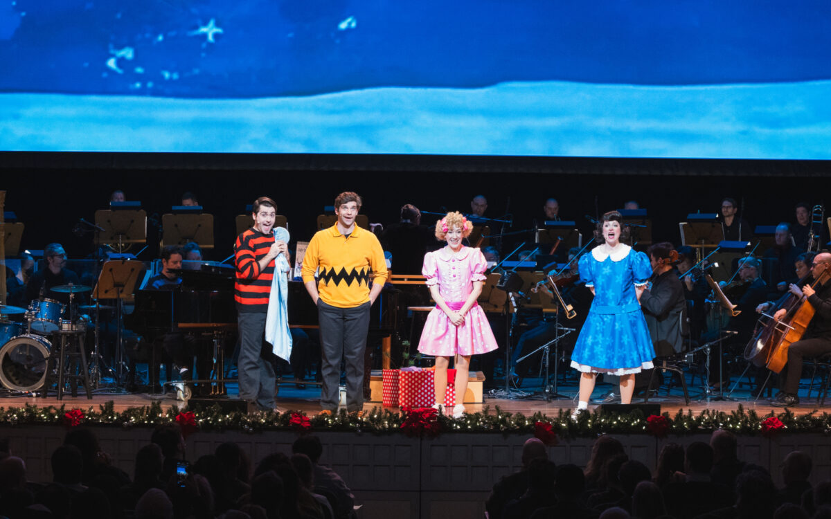 Four performers on stage in A Charlie Brown Christmas