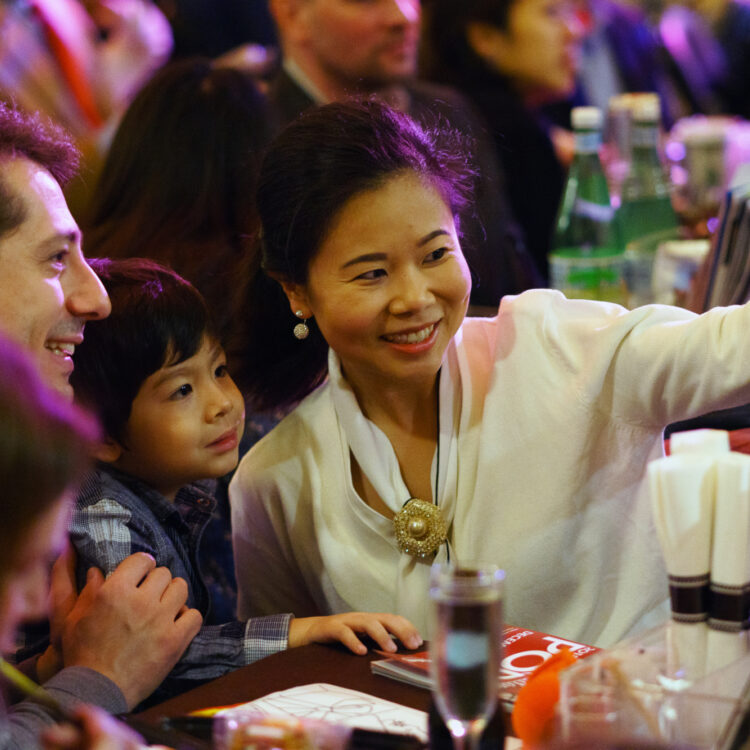 A family taking a selfie at a Boston Pops performance